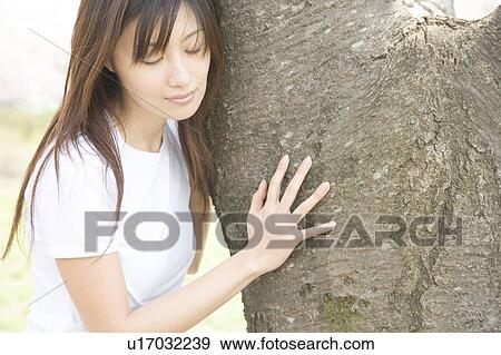 Stock Photo - Tree and woman. Fotosearch