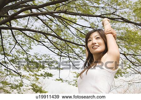 Tree and woman View Large Photo Image Stock Photo - Tree and woman. Fotosearch