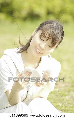 Stock Photography - Woman reading a book. Fotosearch