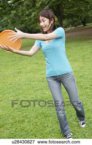 Woman who does frisbee View Large Photo Image Stock Photo - Woman who does frisbee. Fotosearch