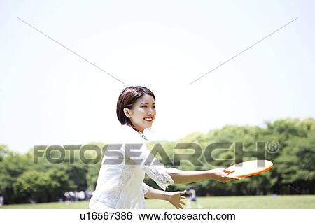 Stock Photograph - Woman who does frisbee. Fotosearch