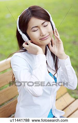 Woman who hangs upon the music View Large Photo Image Stock Photo - Woman who hangs upon the music. Fotosearch