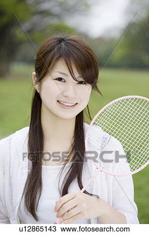 Stock Image - Woman who plays badminton. Fotosearch