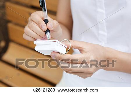 Woman who writes in the word notebook View Large Photo Image Stock Image - Woman who writes in the word notebook. Fotosearch