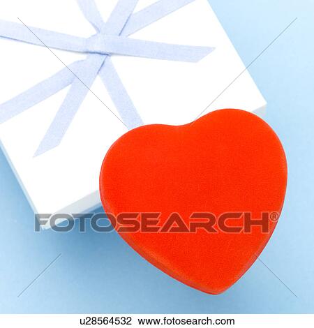 Big heart-shaped object on gift box View Large Photo Image Stock Image - Big heart-shaped object on gift box. Fotosearch