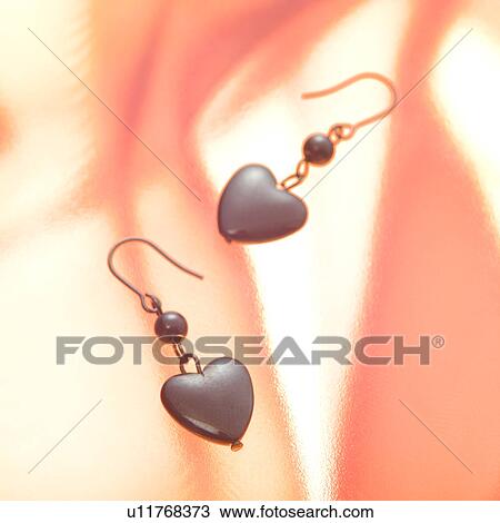 Stock Image - Heart earrings. Fotosearch