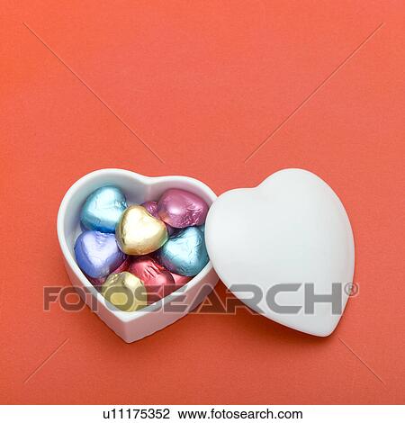 Stock Image - Heart-shaped chocolates. Fotosearch