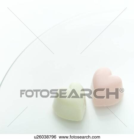 Stock Photograph - Heart-shaped chocolates. Fotosearch