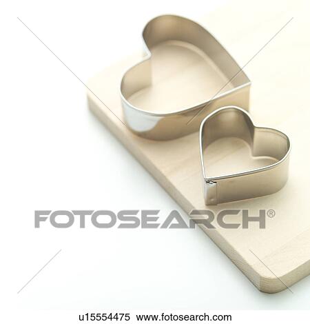 Heart-shaped cookie cutters View Large Photo Image Stock Photography - Heart-shaped cookie cutters. Fotosearch