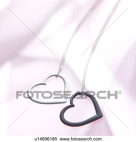 Heart-shaped pendants View Large Photo Image Stock Photography - Heart-shaped pendants. Fotosearch