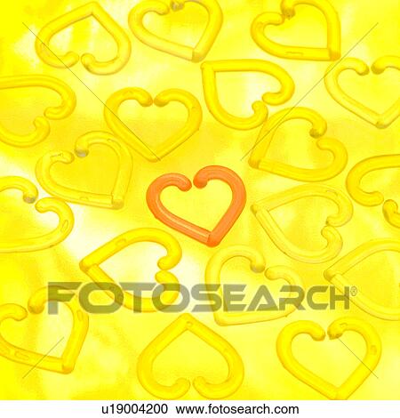 Stock Image - Heart-shaped rings. Fotosearch