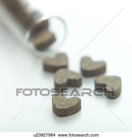 Heart-shaped tea leaf tablets View Large Photo Image Picture - Heart-shaped tea leaf tablets. Fotosearch
