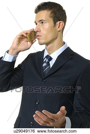 Stock Photograph - Close-up of a businessman using a mobile phone. Fotosearch