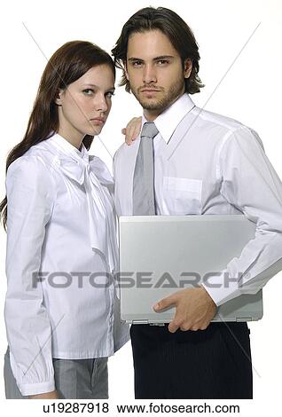 Portrait of a businessman and a businesswoman standing together View Large Photo Image Stock Photo - Portrait of a businessman and a businesswoman standing together. Fotosearch