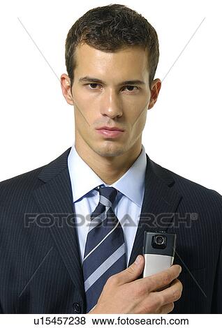 Stock Photo - Portrait of a businessman holding a mobile phone. Fotosearch