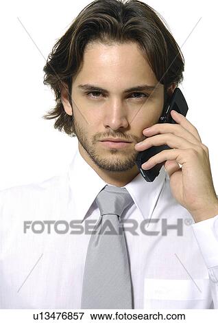 Portrait of a businessman using a mobile phone View Large Photo Image Stock Photo - Portrait of a businessman using a mobile phone. Fotosearch