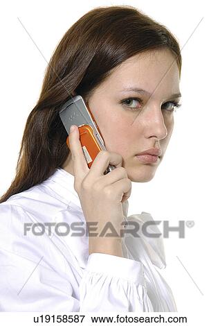 Stock Photo - Portrait of a businesswoman using a mobile phone. Fotosearch