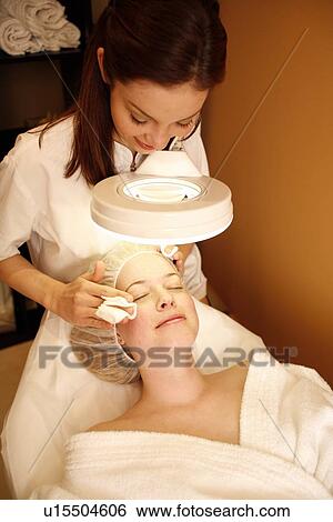 Woman having a facial treatment at a spa View Large Photo Image Stock Photograph - Woman having a facial treatment at a spa. Fotosearch