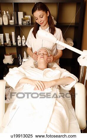 Woman having a facial treatment at a spa View Large Photo Image Stock Photography - Woman having a facial treatment at a spa. Fotosearch