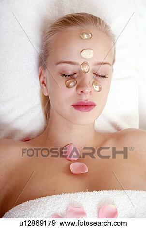 Woman having a facial treatment in a spa View Large Photo Image Stock Photo - Woman having a facial treatment in a spa. Fotosearch