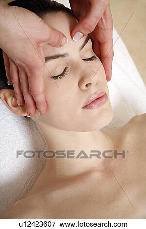 Stock Photo - Woman having facial massage. Fotosearch