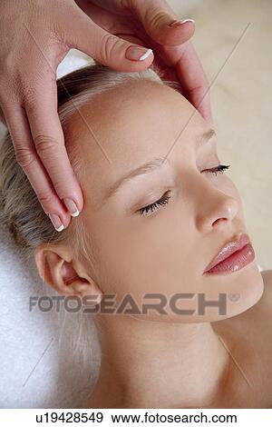 Woman having facial massage View Large Photo Image Stock Photo - Woman having facial massage. Fotosearch