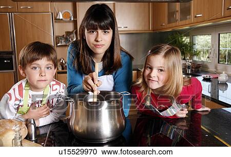 Stock Image - Children cooking. Fotosearch