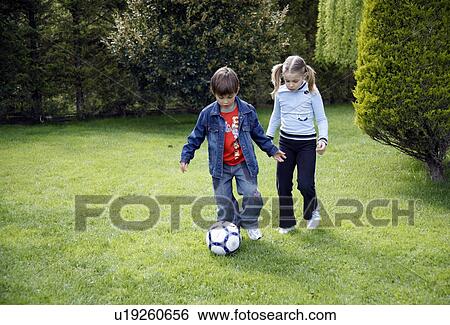 Children playing soccer View Large Photo Image Stock Photograph - Children playing soccer. Fotosearch