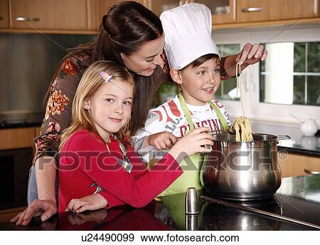 Mother and children cooking View Large Photo Image Stock Photo - Mother and children cooking . Fotosearch