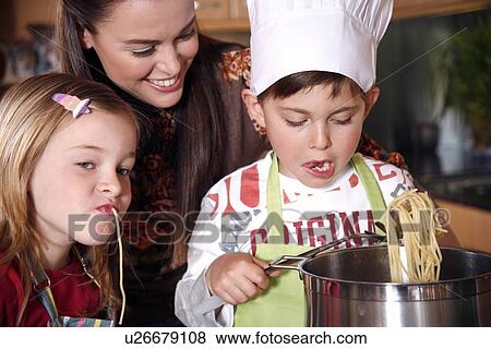 Mother and children cooking View Large Photo Image Stock Photo - Mother and children cooking . Fotosearch