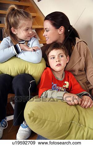 Mother with tired children on staircase View Large Photo Image Stock Photo - Mother with tired children on staircase. Fotosearch