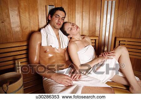 A couple enjoying a sauna together View Large Photo Image Stock Image - A couple enjoying a sauna together. Fotosearch