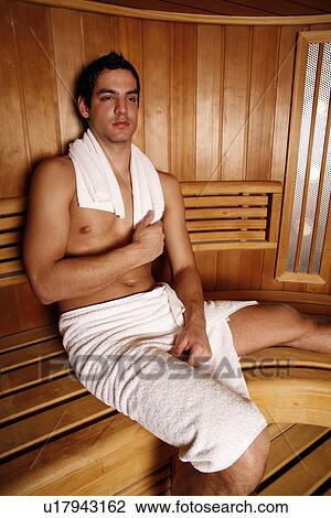 Stock Image - A man enjoying a sauna. Fotosearch