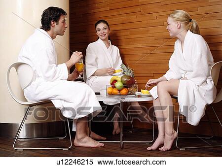 Friends having a refreshment after a spa treatment View Large Photo Image Stock Photography - Friends having a refreshment after a spa treatment. Fotosearch