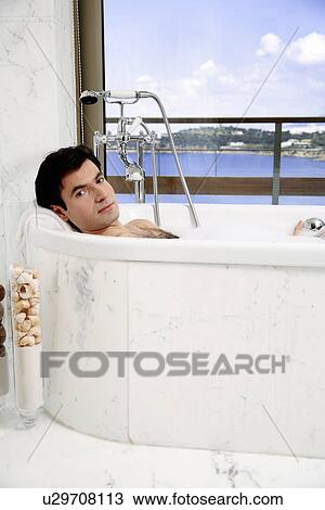 Man enjoying bubble bath View Large Photo Image Stock Image - Man enjoying bubble bath. Fotosearch