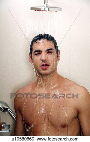 Man taking a shower at the gym View Large Photo Image Stock Image - Man taking a shower at the gym. Fotosearch
