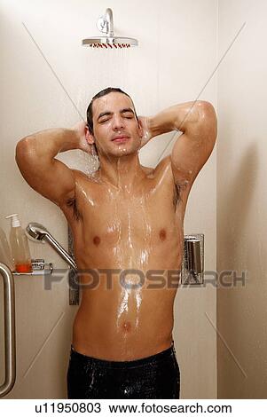 Stock Image - Man taking a shower at the gym. Fotosearch