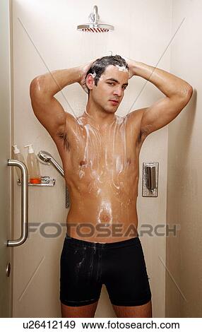 Man taking a shower at the gym View Large Photo Image Stock Photo - Man taking a shower at the gym. Fotosearch