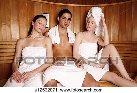 Man with two young women enjoying a sauna View Large Photo Image Stock Image - Man with two young women enjoying a sauna. Fotosearch