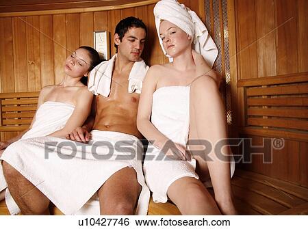 Man with two young women enjoying a sauna View Large Photo Image Stock Photograph - Man with two young women enjoying a sauna. Fotosearch