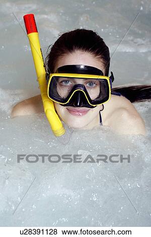 One woman wearing mask and snorkel in jacuzzi at a spa View Large Photo Image Stock Photo - One woman wearing mask and snorkel in jacuzzi at a spa. Fotosearch