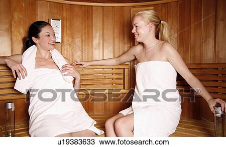 Two young women enjoying a sauna View Large Photo Image Stock Image - Two young women enjoying a sauna. Fotosearch