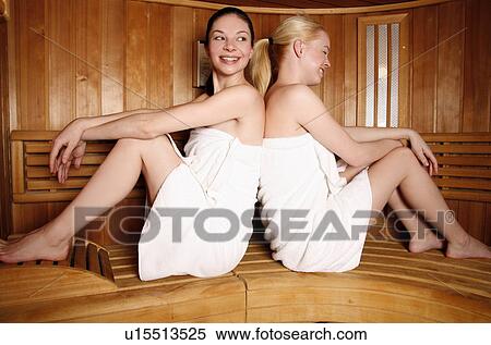 Stock Photography - Two young women enjoying a sauna. Fotosearch