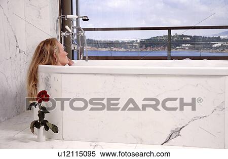 Woman enjoying bubble bath View Large Photo Image Stock Photography - Woman enjoying bubble bath. Fotosearch