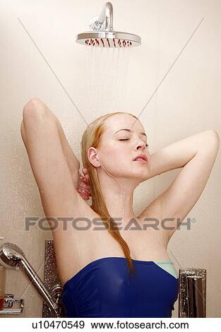 Woman taking a shower at the gym View Large Photo Image Stock Photo - Woman taking a shower at the gym. Fotosearch