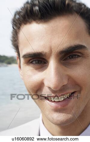 Stock Image - Businessman on the beach. Fotosearch