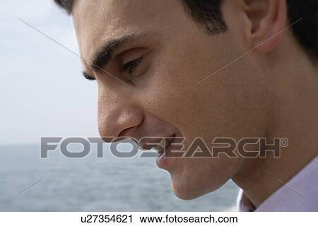 Stock Image - Businessman on the beach. Fotosearch