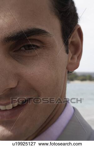 Stock Photo - Businessman on the beach. Fotosearch