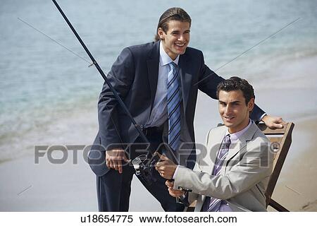 Businessmen on beach fishing View Large Photo Image Stock Photography - Businessmen on beach fishing. Fotosearch