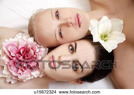 Picture - Beauty shot of two young faces side by side. Fotosearch